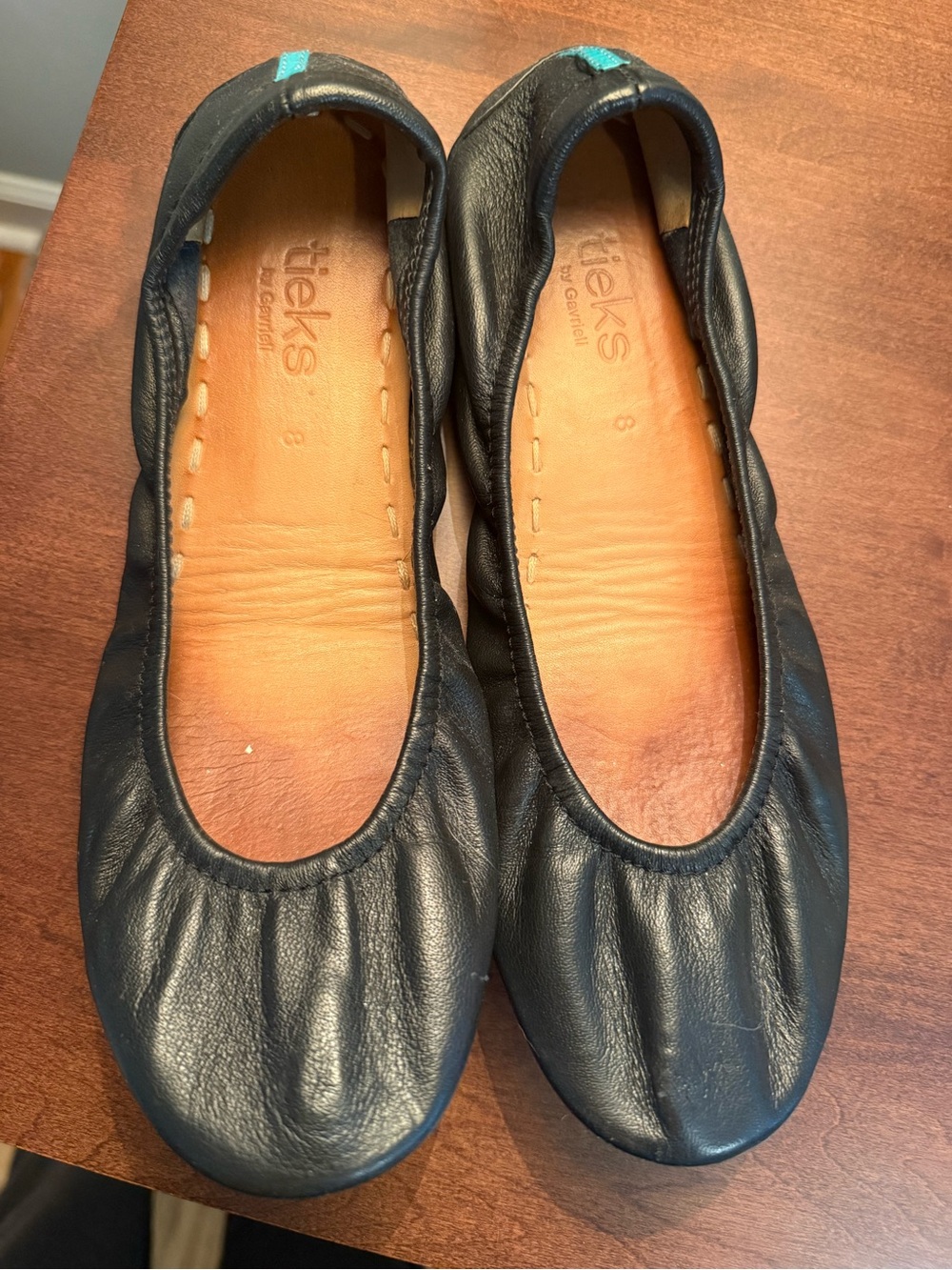 Tieks Black Leather Ballet Flats with Teal Heel Tab